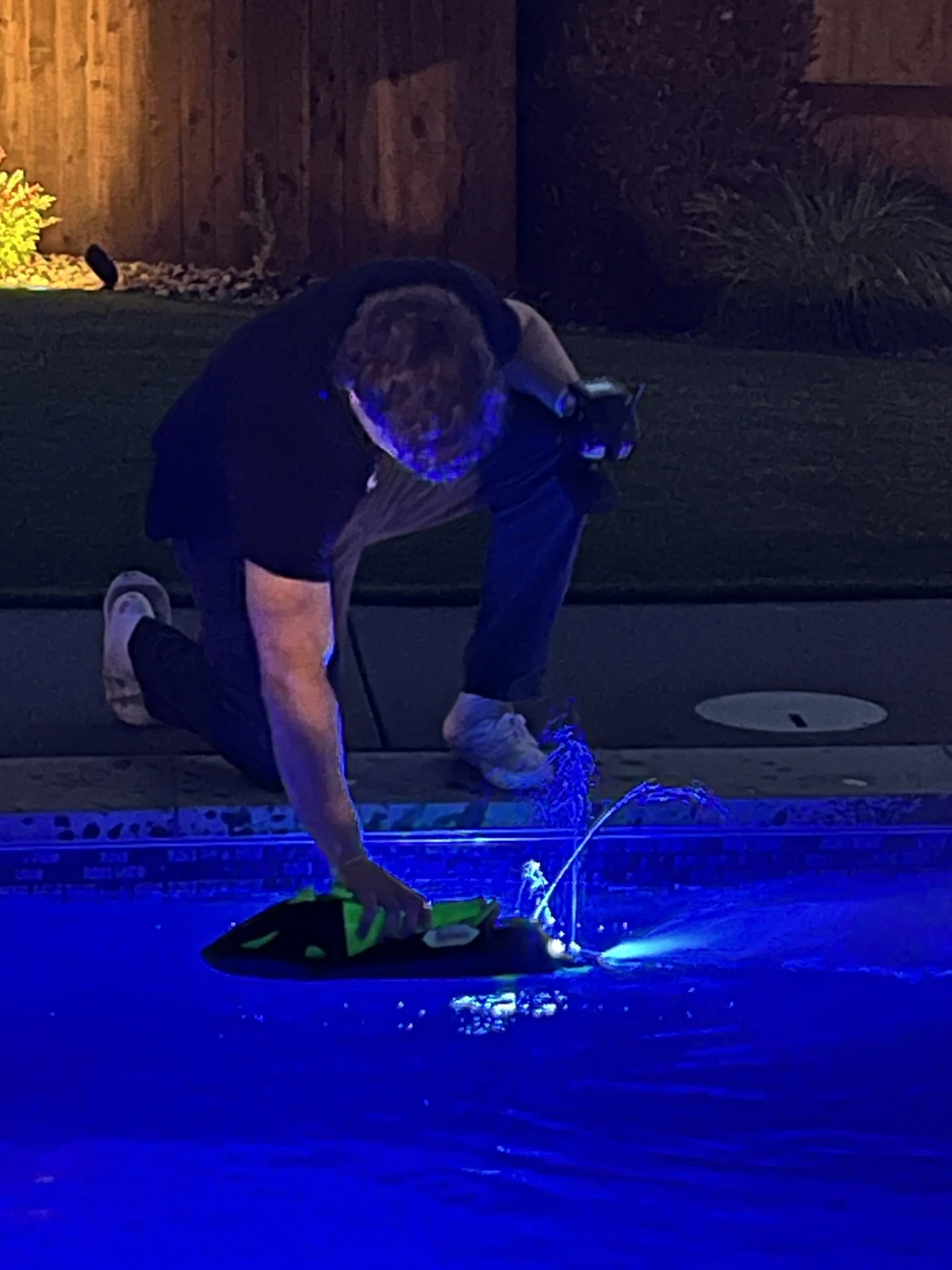 Assembled Valkyrie with visible jet discharge while held at the pool edge.